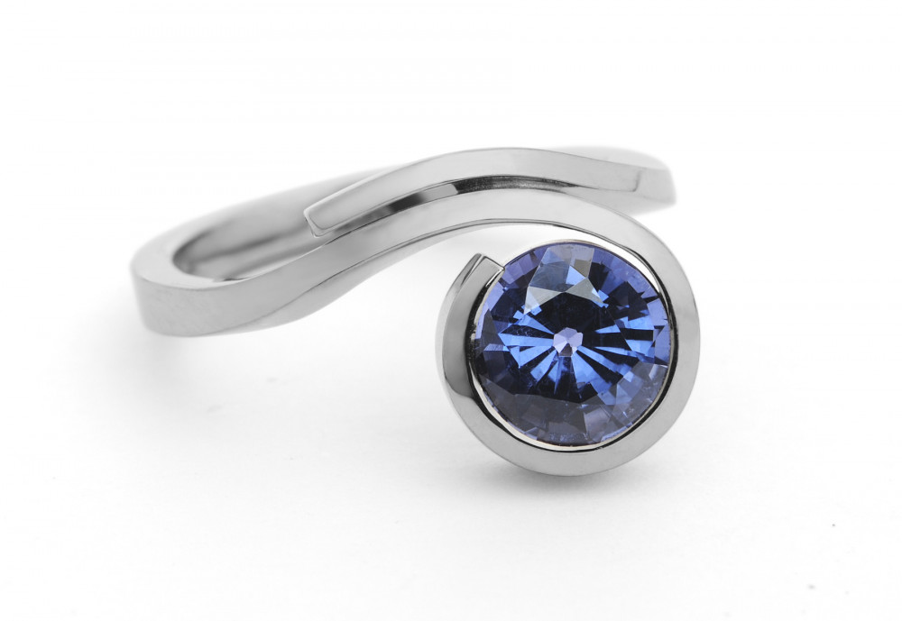 Forged white gold and blue spinel dress ring