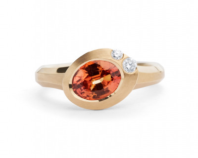 Arris carved rose gold ring with oval orange sapphire and white diamonds