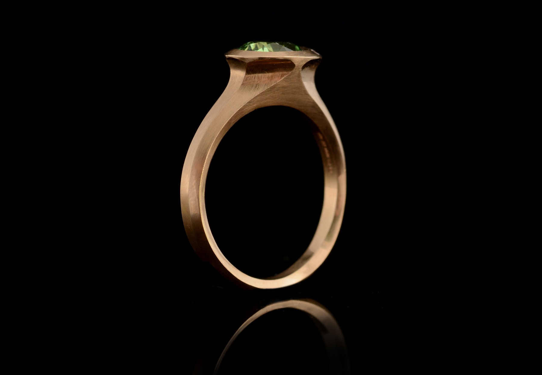 Carved rose gold Arris ring with oval tsavorite garnet and white diamonds