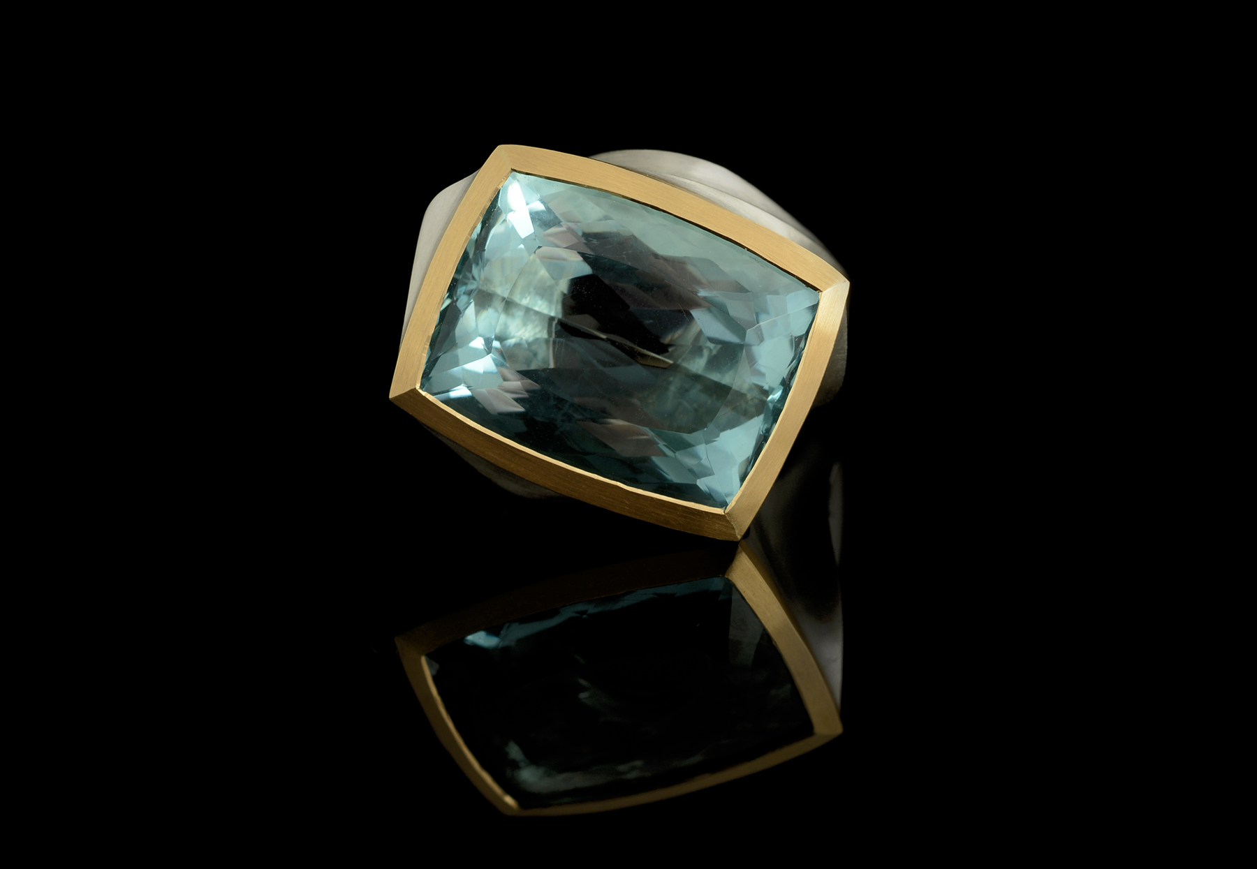 Arris carved statement cocktail ring with blue stone