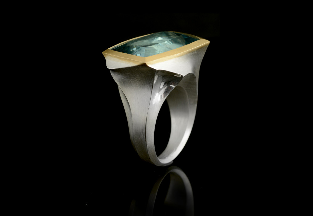 Arris silver and gold cocktail ring with blue stone