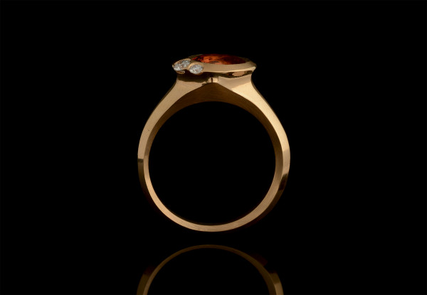 Rose gold Arris ring with oval orange sapphire and two white diamonds