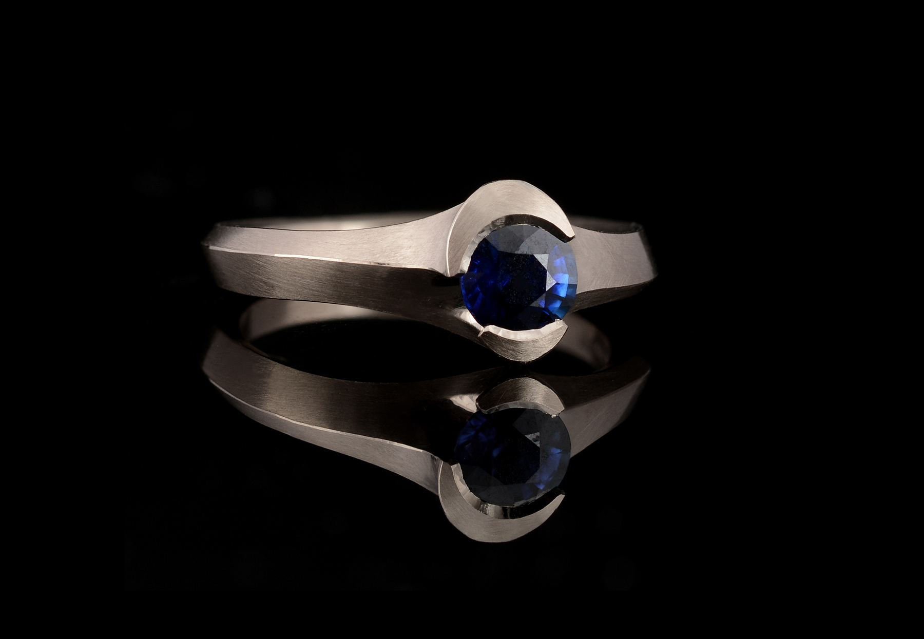 Carved Arris white gold and sapphire engagement ring