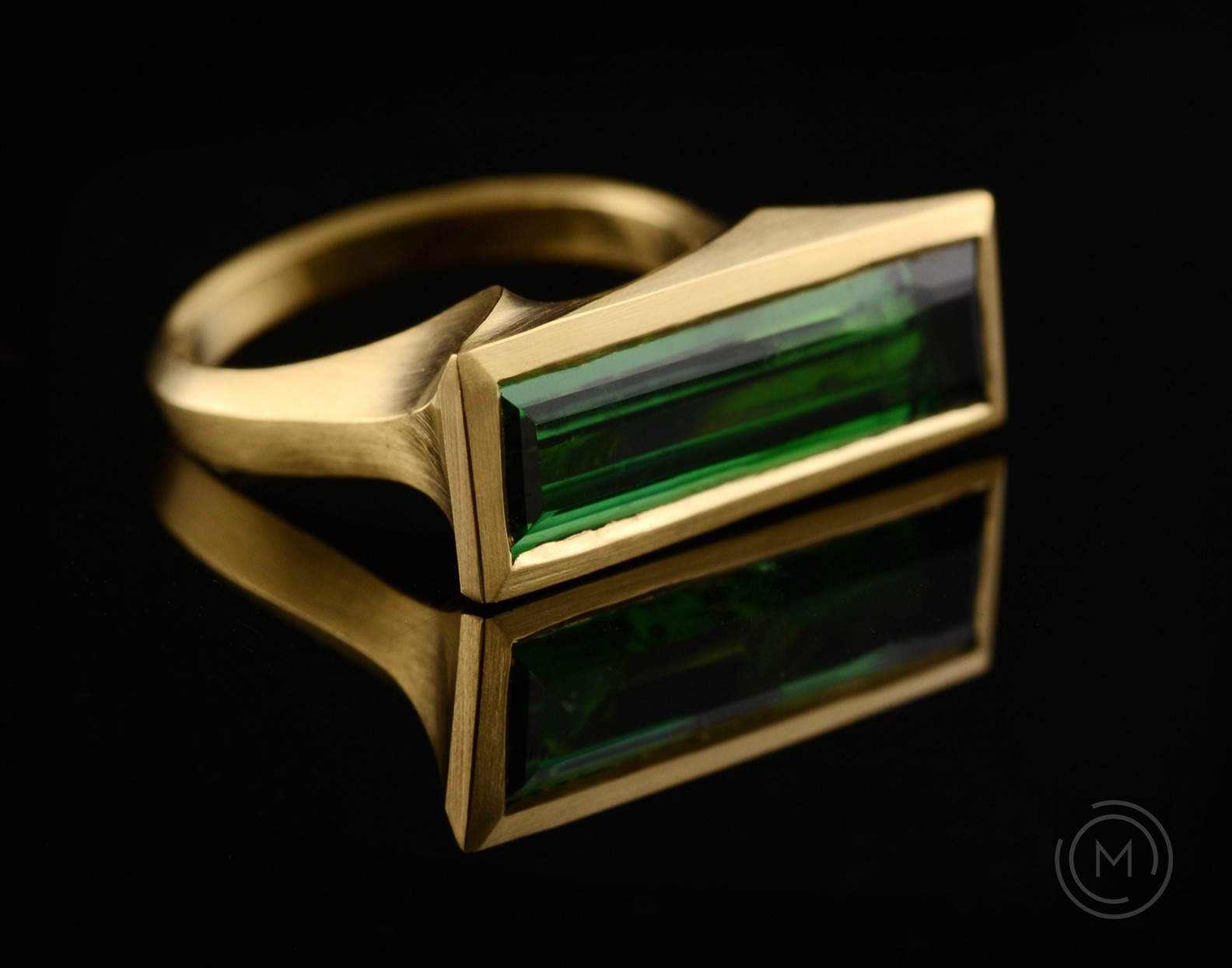 Carved gold Arris cocktail ring with baguette tourmaline