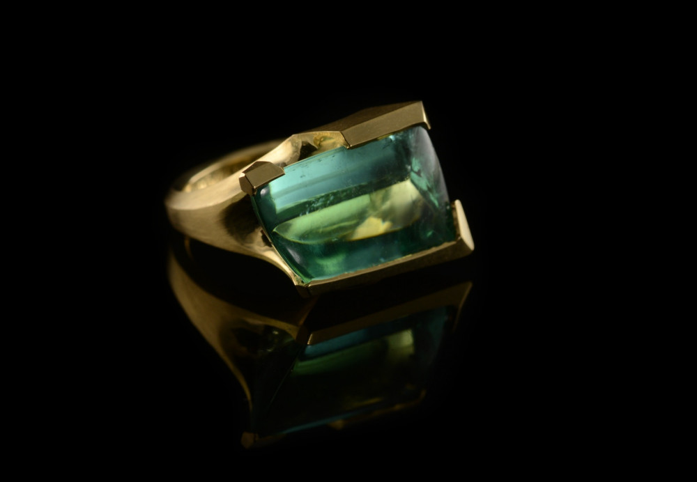 Carved gold cocktail ring with fancy-cut green tourmaline