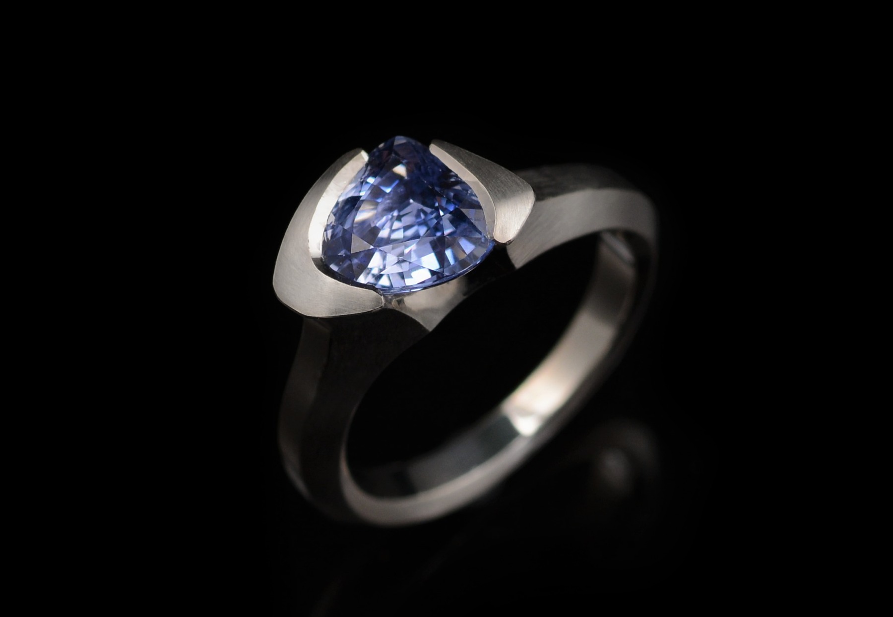 Carved platinum and trillion sapphire cocktail ring commission