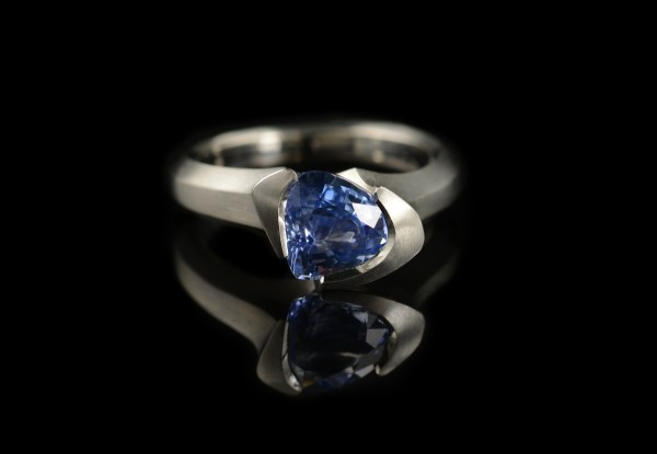 Hand carved platinum cocktail ring with trillion sapphire