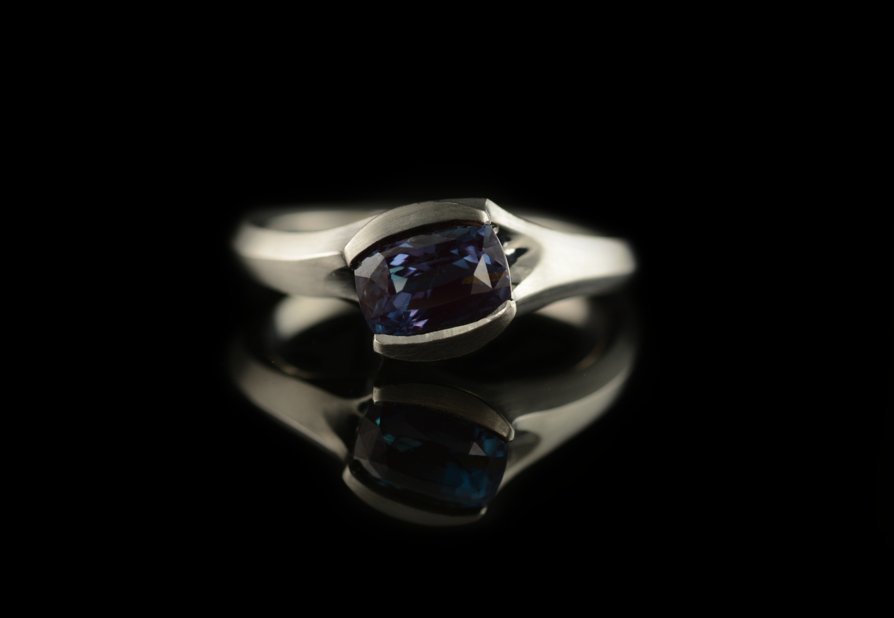 Carved platinum ring with colour change alexandrite stone