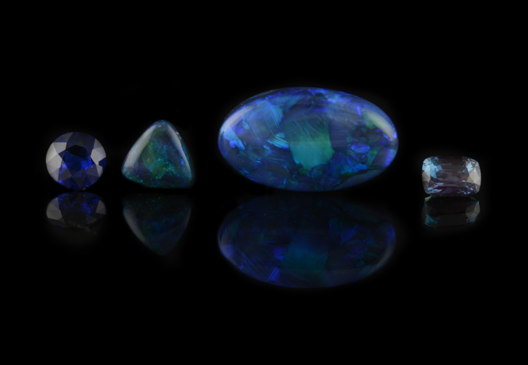 Blue sapphire, opal and alexandrite gemstones