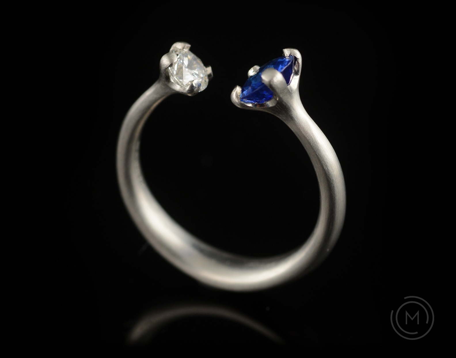 Contemporary engagement ring with two stones - diamond and sapphire