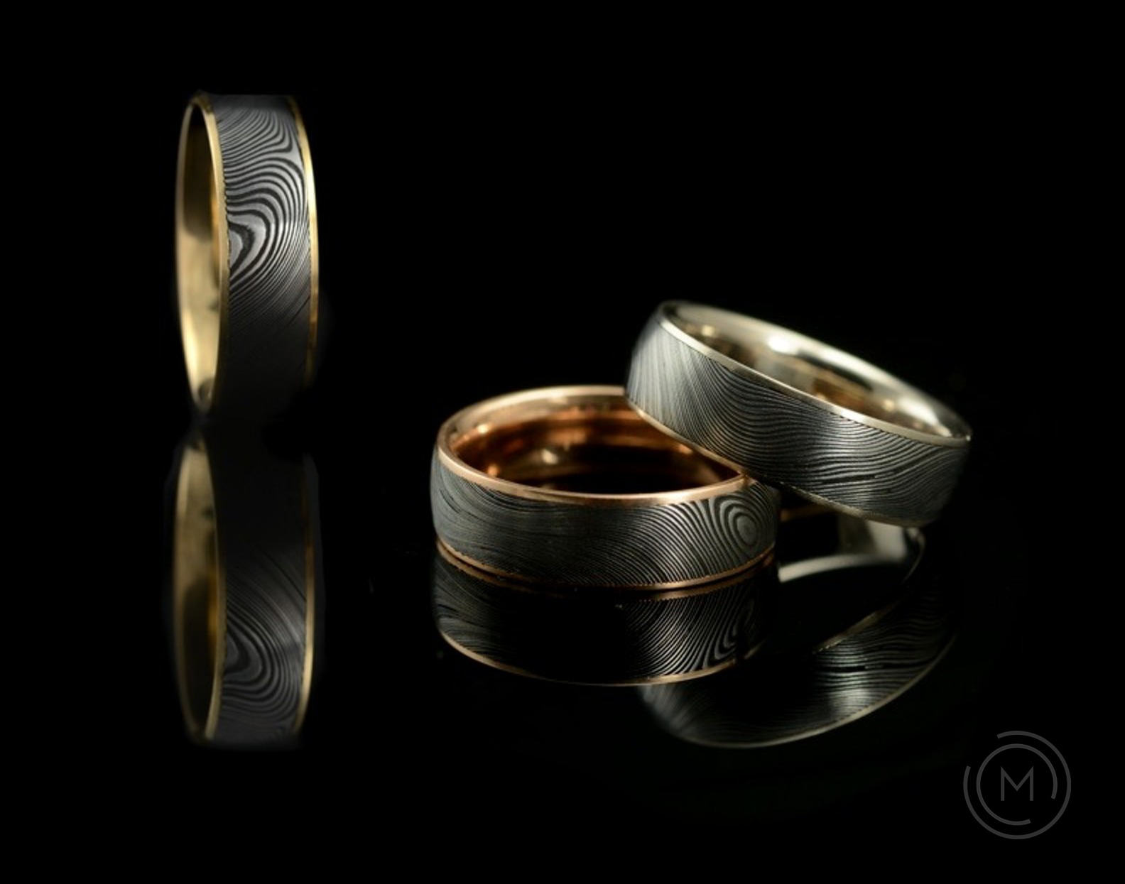 Damascus steel and gold mens wedding rings