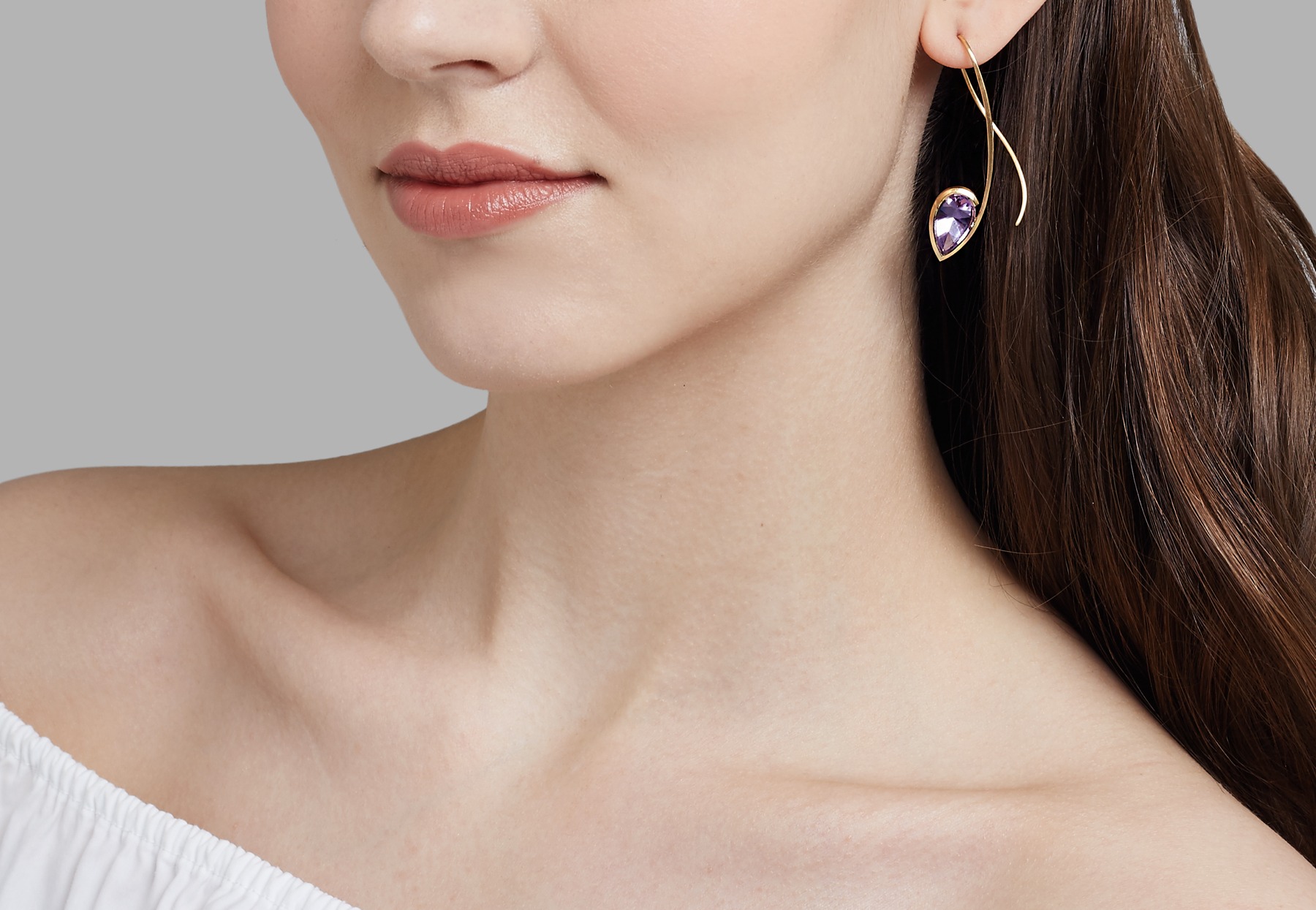 Forged gold and amethyst drop earrings on model