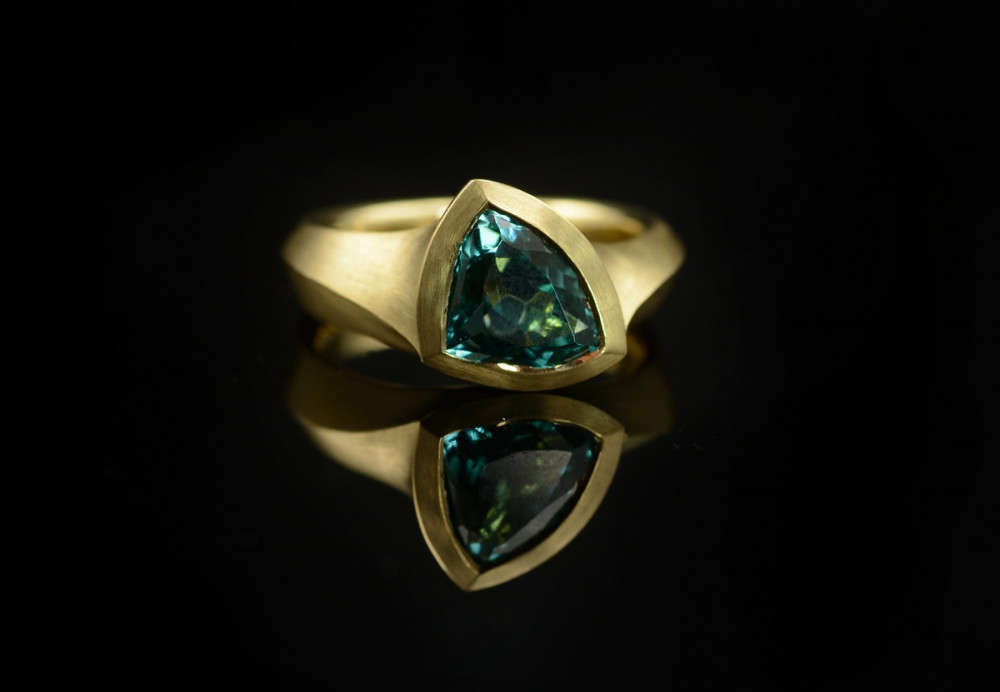 Hand carved yellow gold and trilliant tourmaline engagement ring