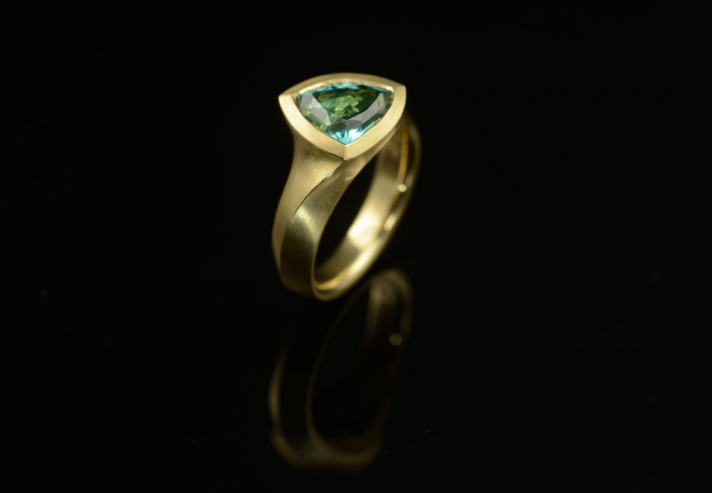 Hand carved yellow gold and trillion tourmaline engagement ring
