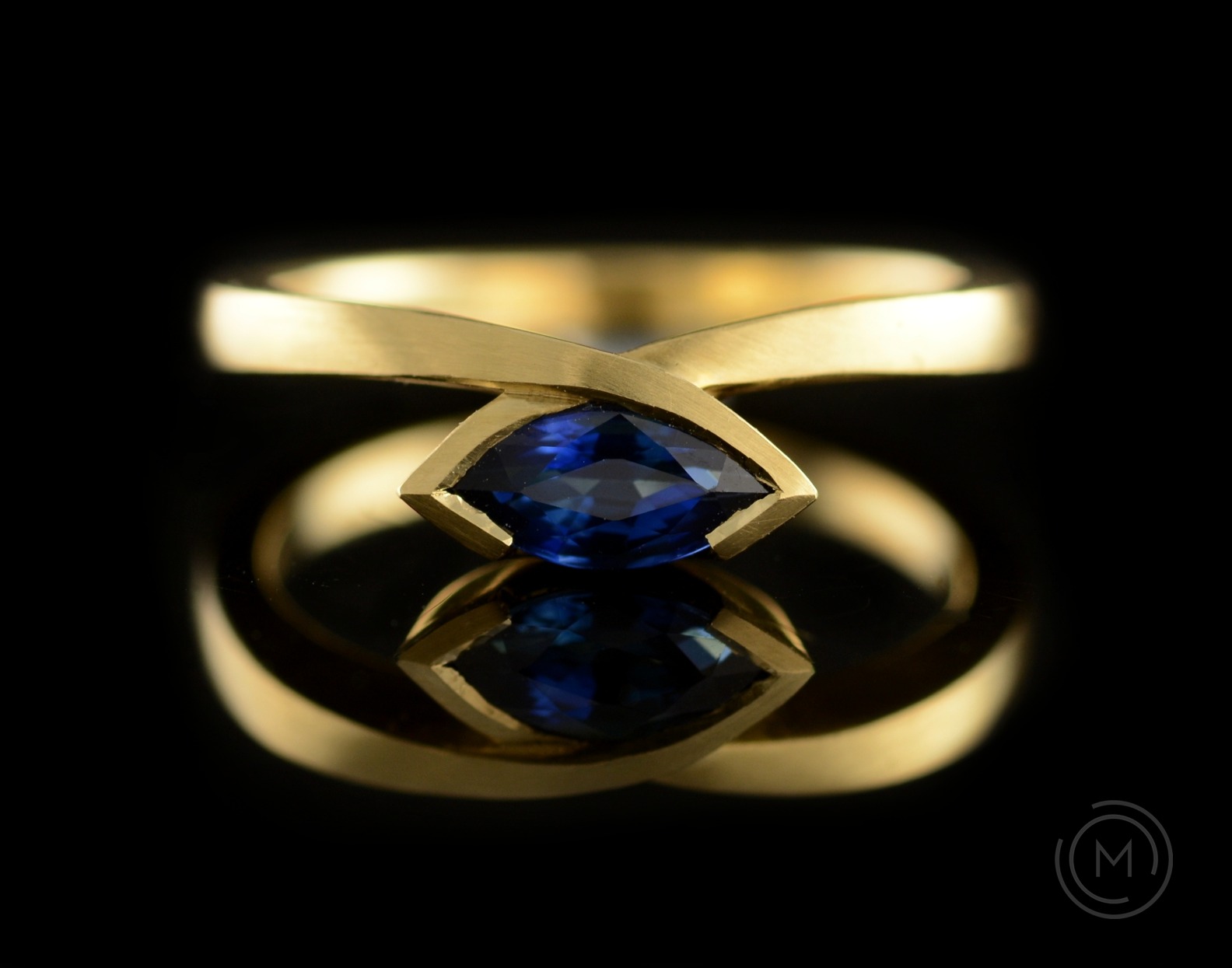 Yellow gold and marquise blue sapphire engagement ring commission