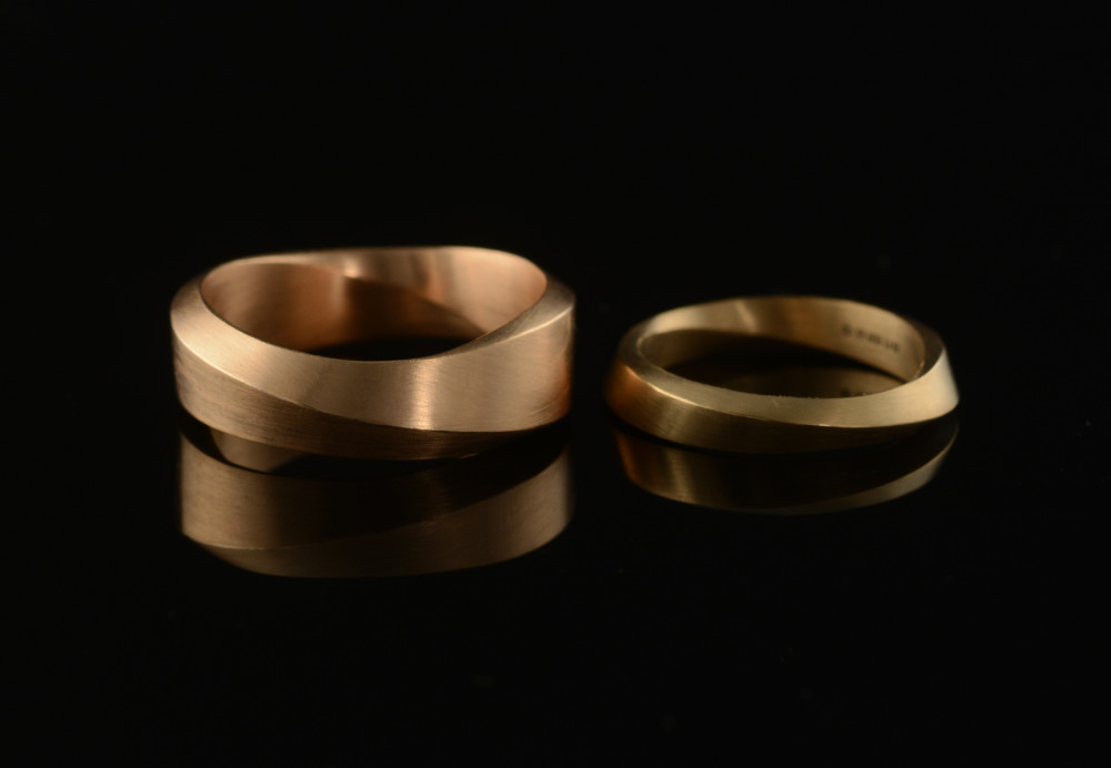 18ct rose and yellow gold Mobius wedding rings