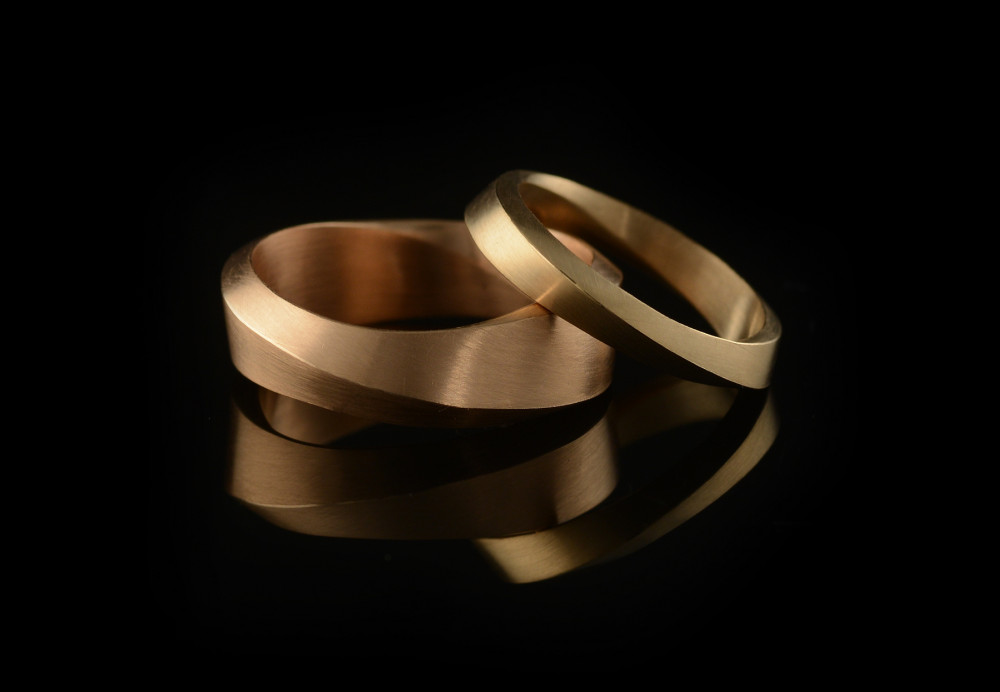 18ct yellow gold men's Mobius wedding ring with 18ct rose gold ladies' wedding ring