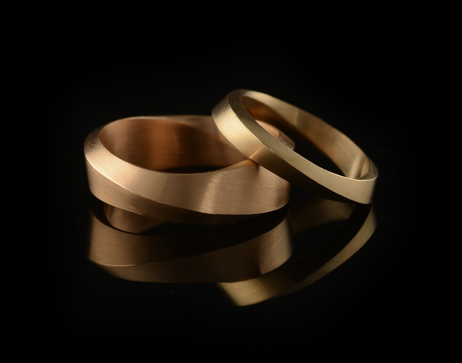 Mobius wedding rings for men - 18 carat rose gold - McCaul Goldsmiths London