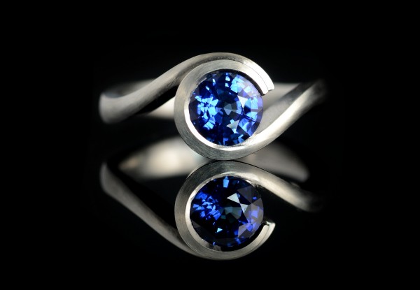 Modern platinum and blue sapphire Wave engagement ring