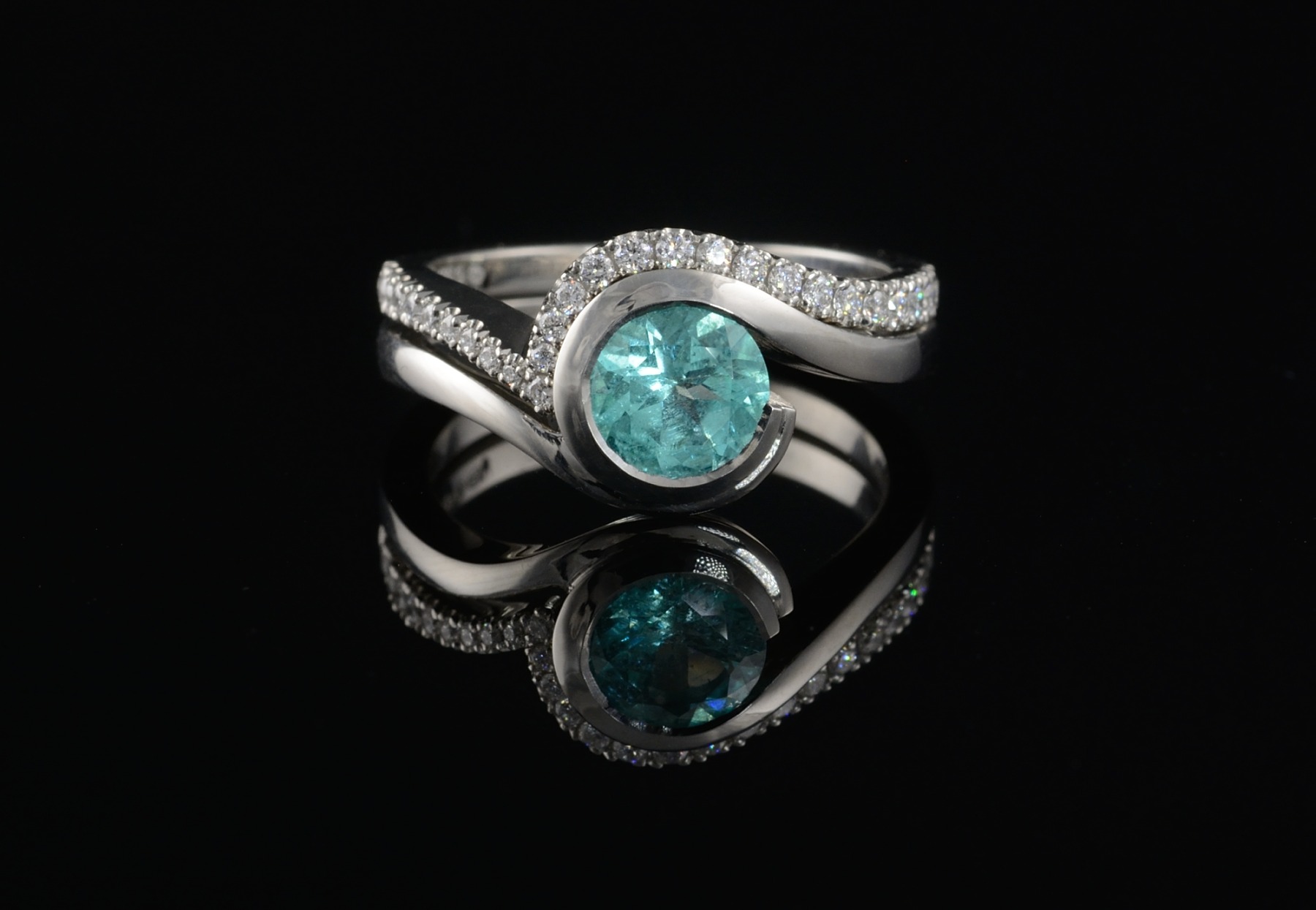 Paraiba tourmaline and platinum-wave engagement ring inspired by the sea