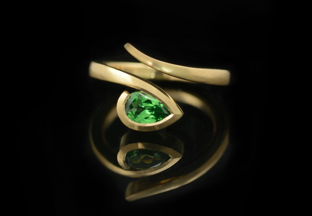 Pear green garnet twist engagement ring
