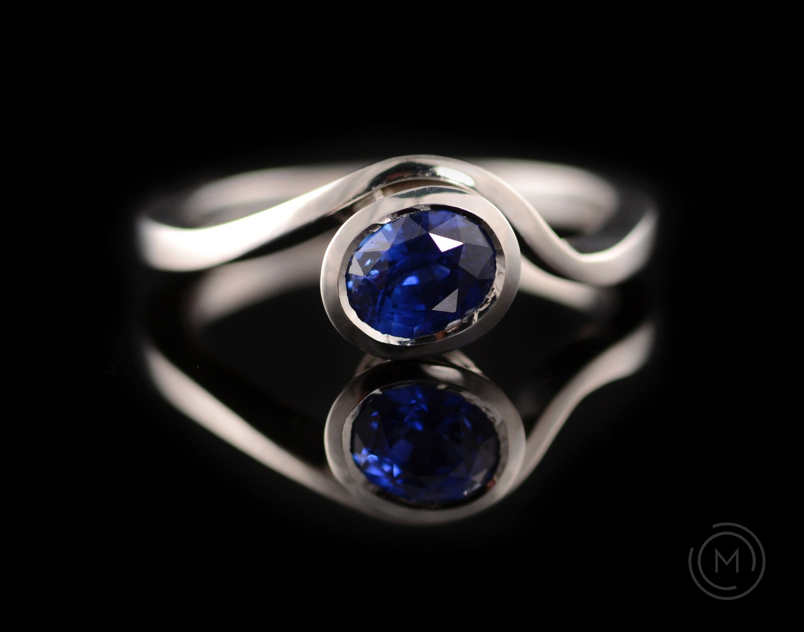 Balance platinum engagement ring with oval blue sapphire