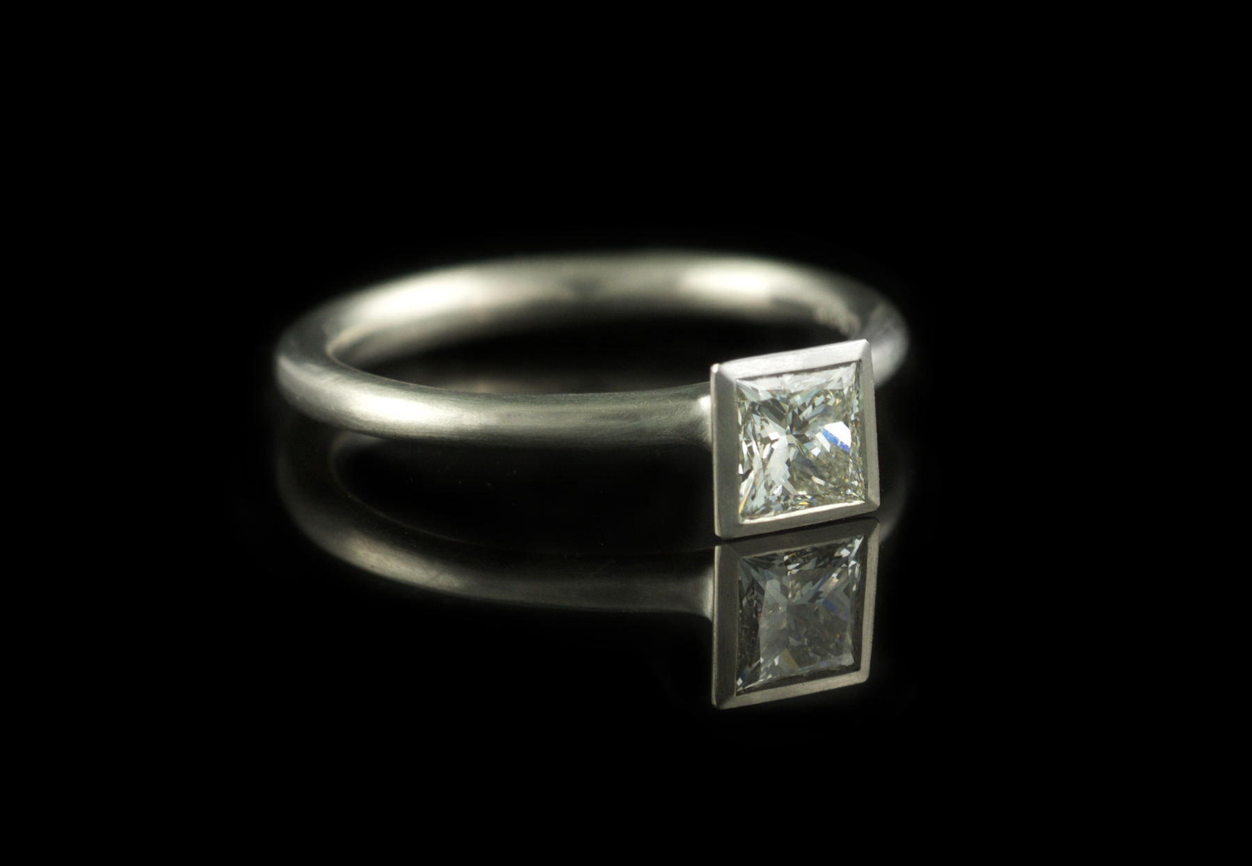 Platinum engagement ring set with princess cut diamond