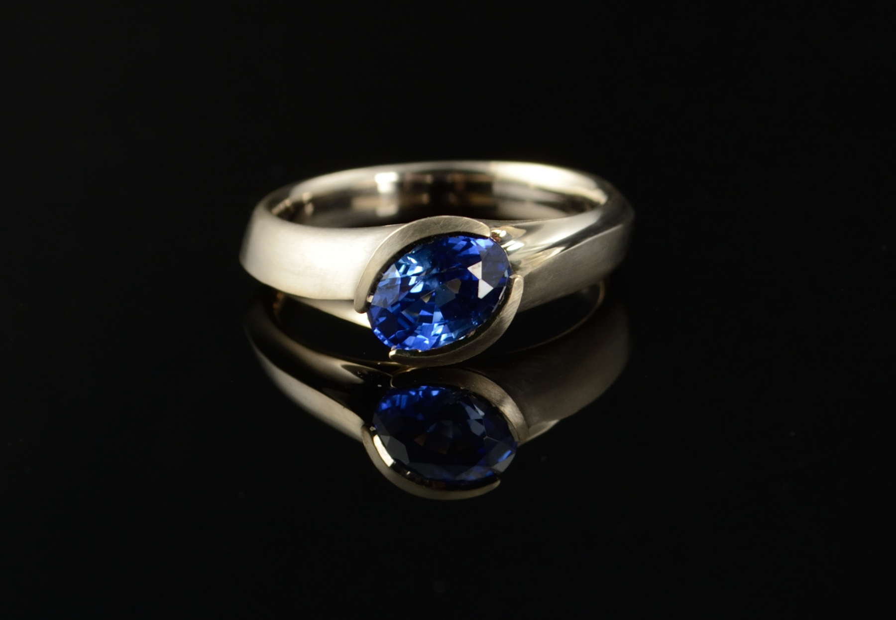 Sapphire engagement ring, hand carved and cast in white gold