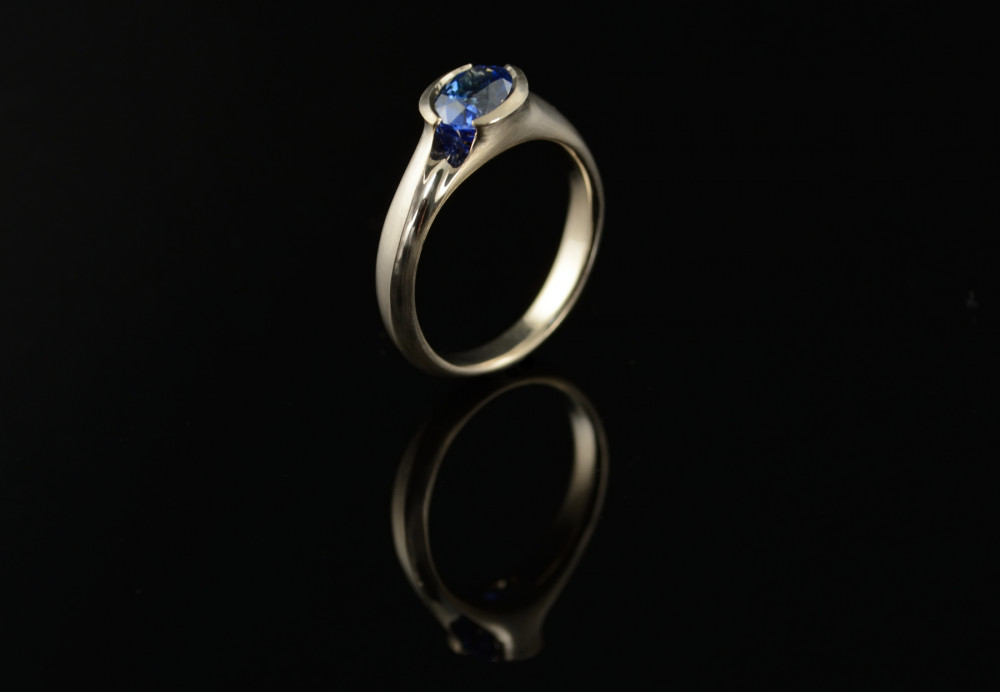 Sapphire engagement ring, hand carved and cast in white gold