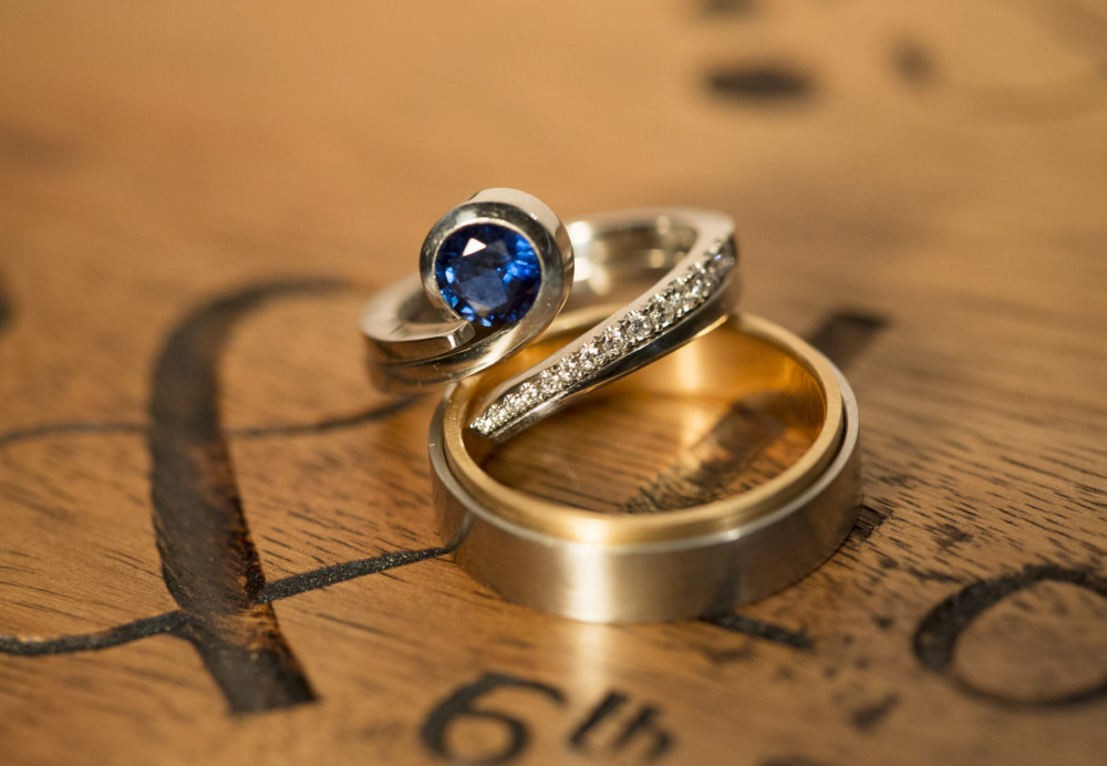 Sapphire, white gold and diamond engagement ring and wedding rings