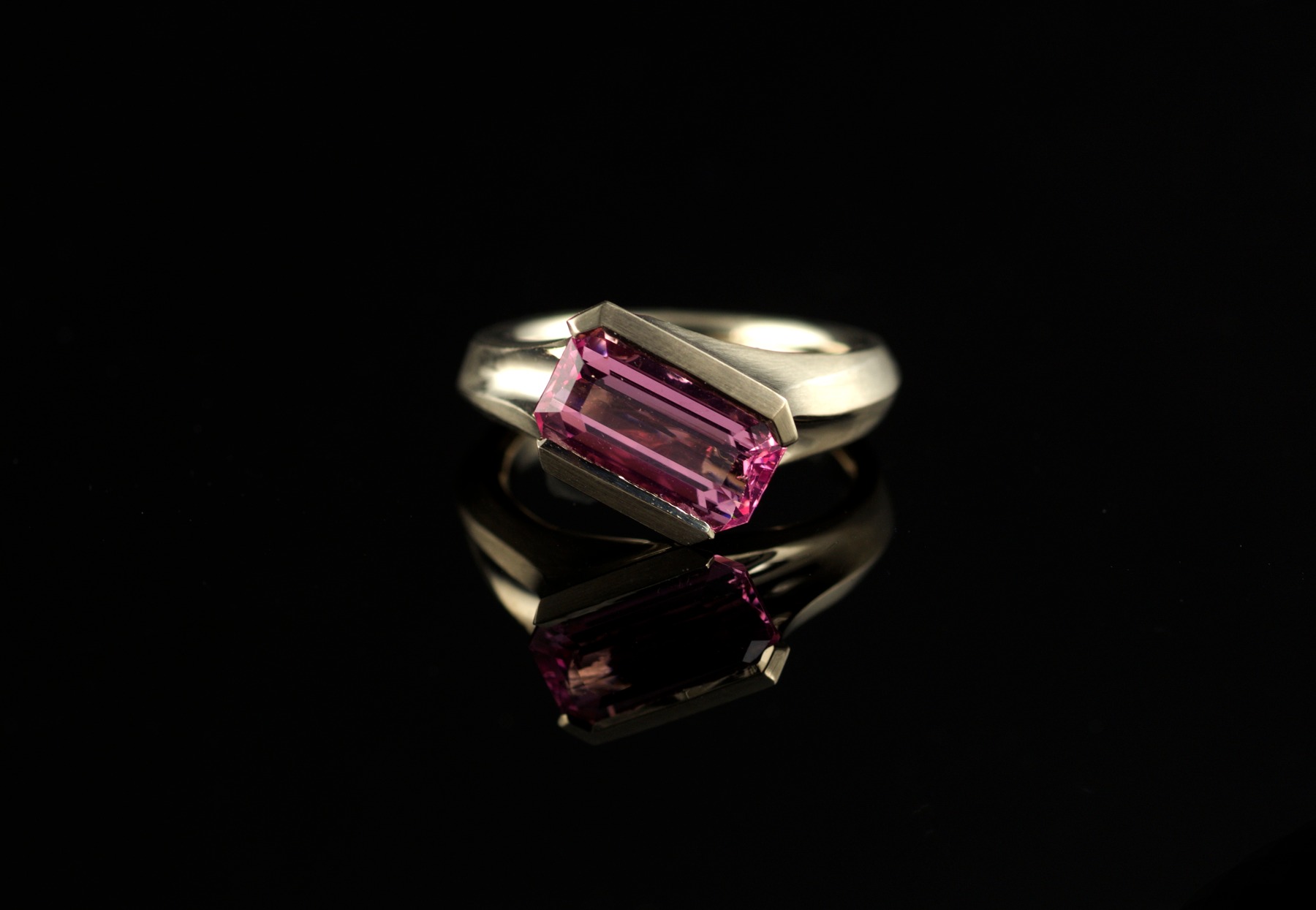 Pink spinel and carved white gold cocktail ring on hand