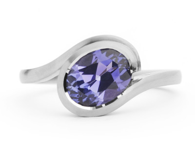 Wave dress or engagement ring in platinum with oval tanzanite