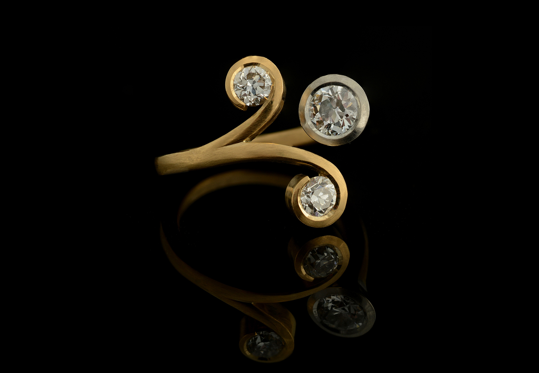 Forged three-stone yellow gold and platinum cocktail ring with old-cut diamonds
