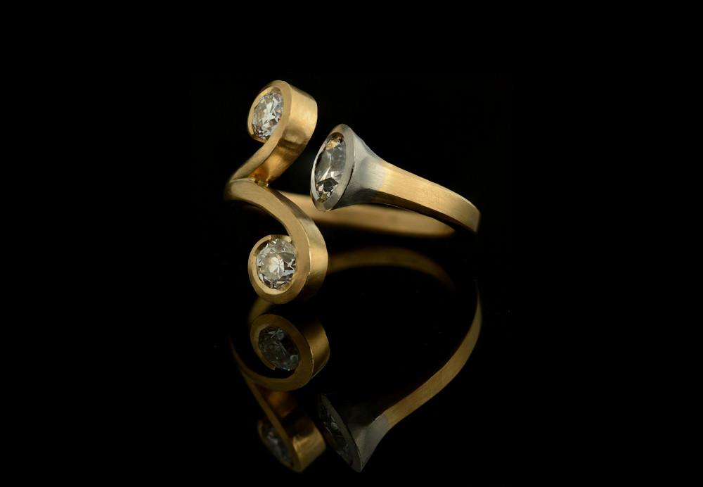 Forged 18ct yellow gold and platinum cocktail ring with three old-cut diamonds
