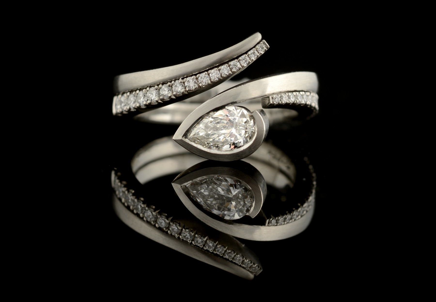 Platinum and diamond Twist engagement ring with fitted diamond wedding band