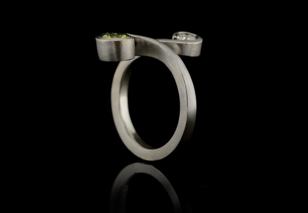 Platinum 'Twist' engagement ring with demantoid and diamond