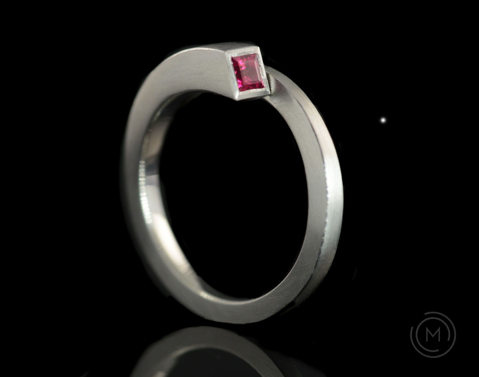 Unusual architectural minimal engagement ring in platinum with princess cut ruby