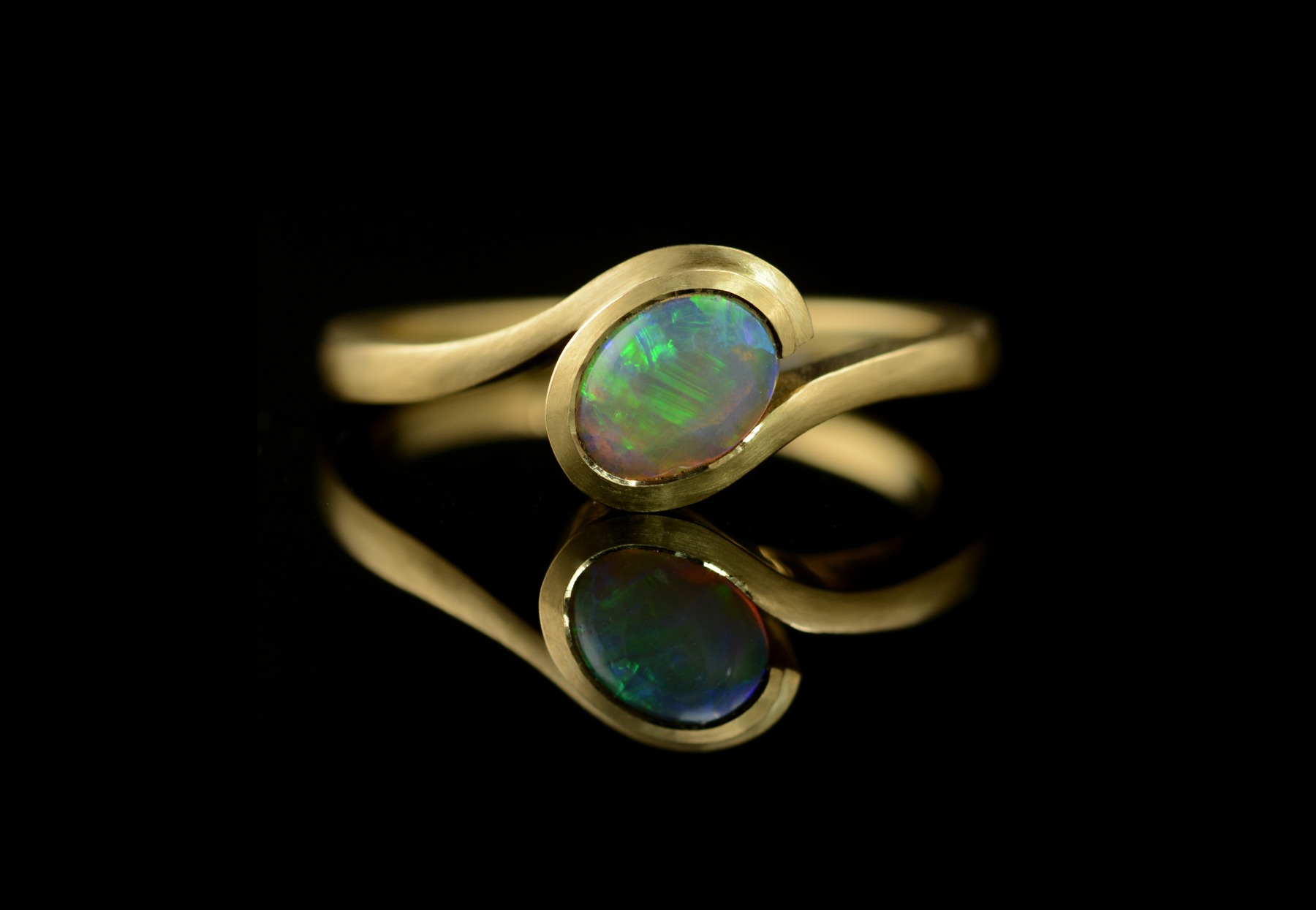 Oval opal and yellow gold Wave engagement ring