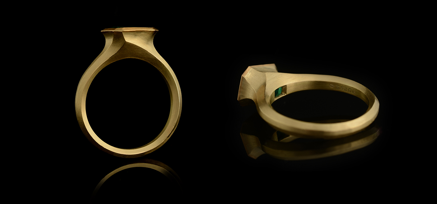 Arris carved yellow gold and emerald ring
