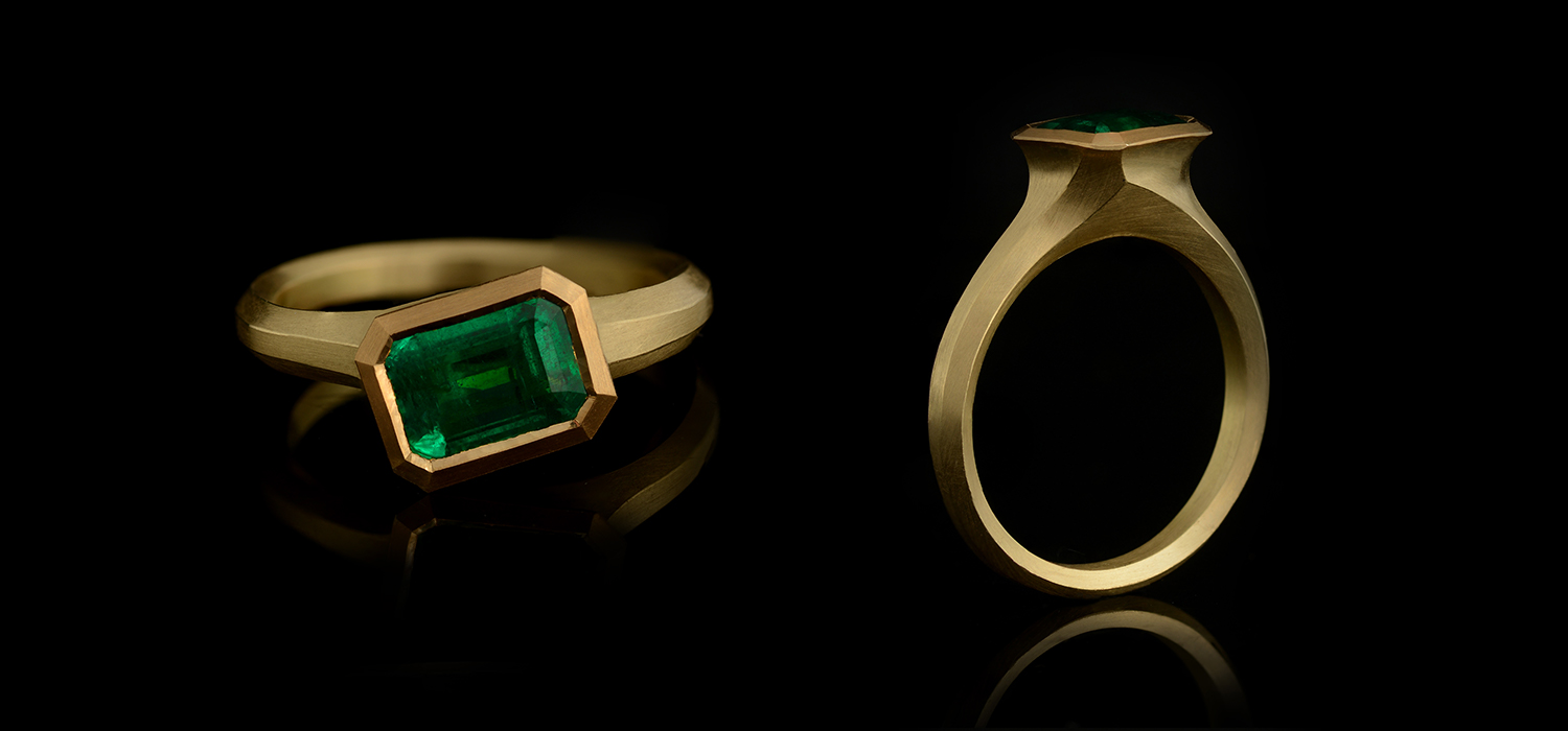 Arris carved 18-carat yellow gold and emerald ring