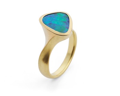 Black opal cocktail ring in hand carved 18 carat yellow gold ring