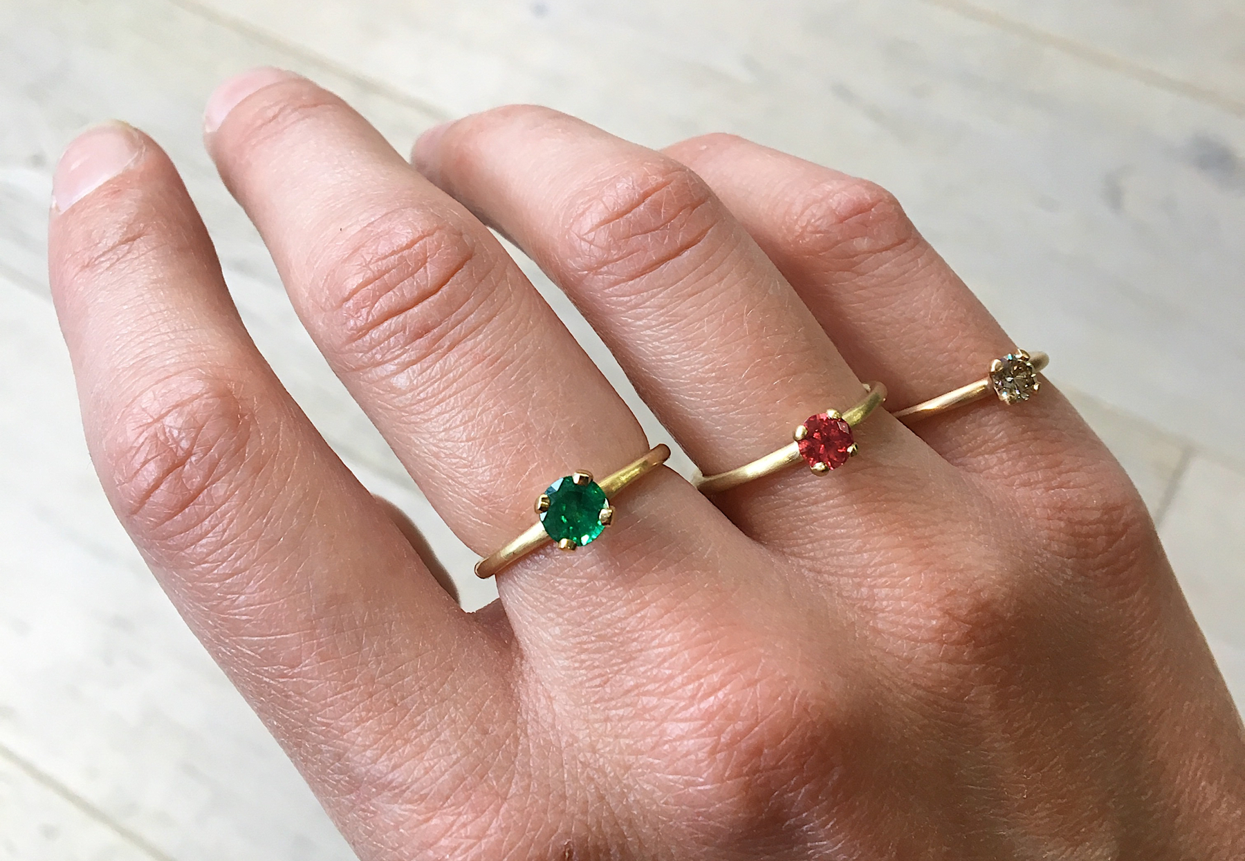 four claw engagement rings ruby emerald and cognac diamond