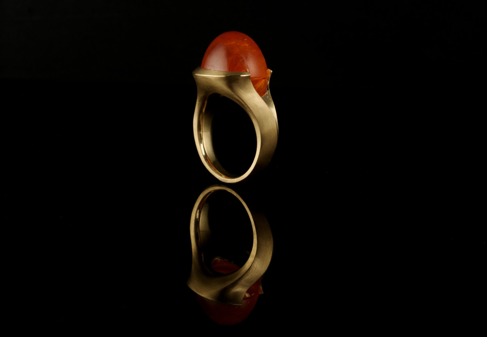 Cabochon mandarin garnet and rose gold carved cocktail ring
