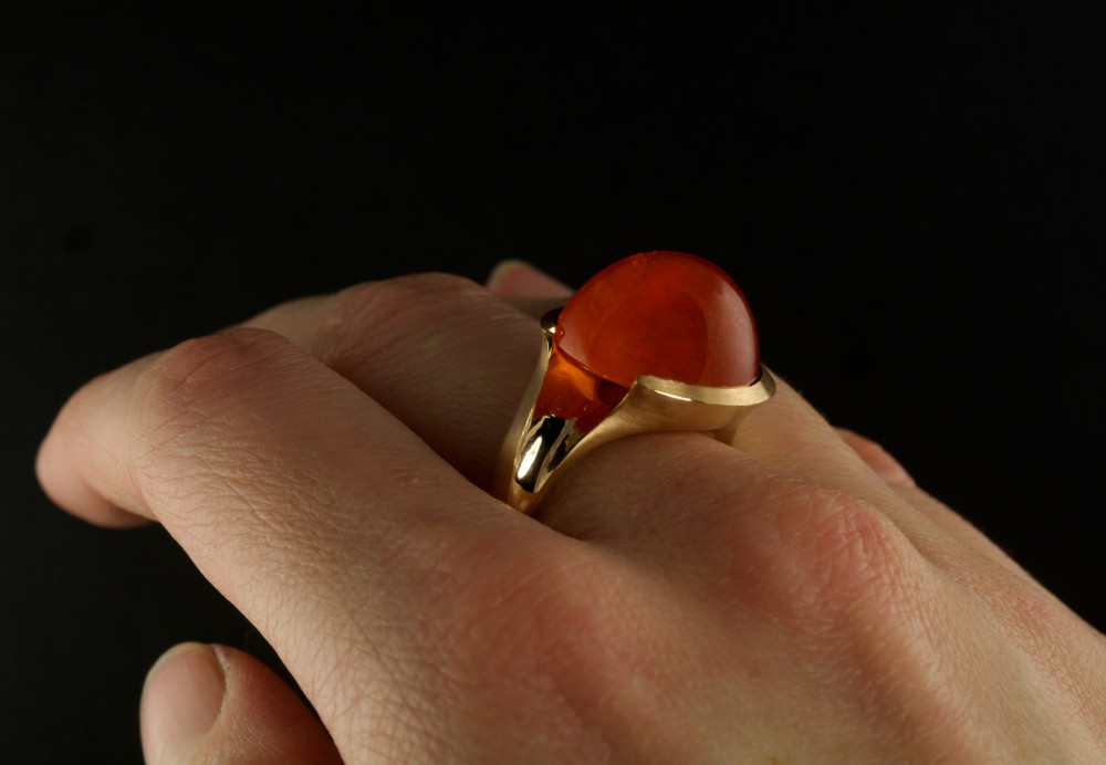 Rose gold hand carved cocktail ring with cabochon mandarin garnet