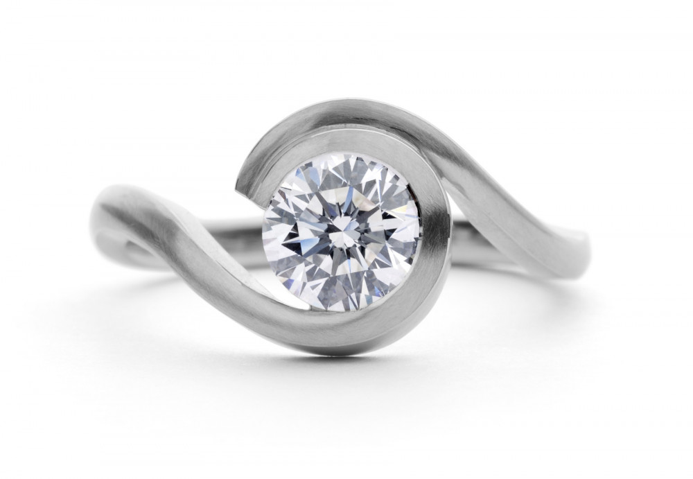 Contemporary platinum 'Wave' engagement ring with 0.9 carat white diamonds