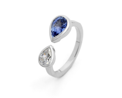 Unique platinum two stone engagement ring with pear diamond and sapphire