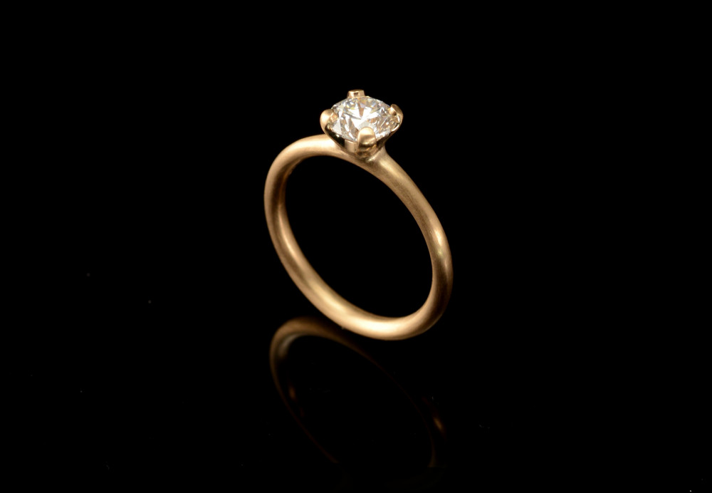 Brushed rose gold engagement ring claw set with an Australian diamond